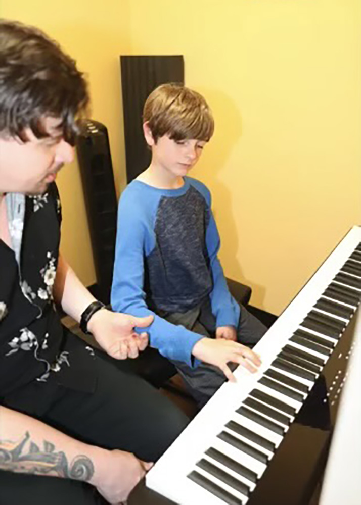 Student and teacher piano lesson